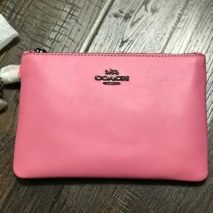 Bubble gum pink Coach wristlet